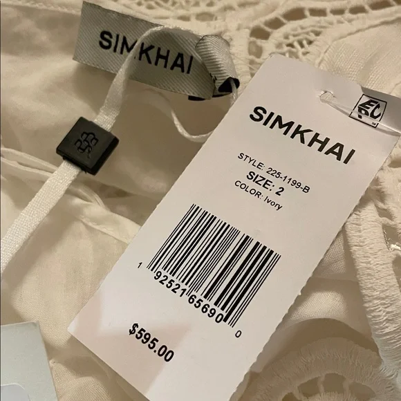 SIMKHAI Ivory Morrigan Short Sleeve Mini Dress. Models is wearing size 2. - Picture 6 of 8